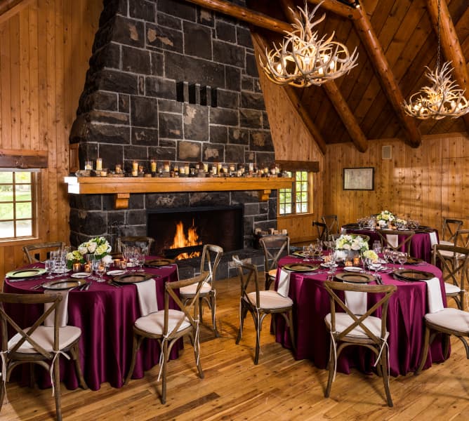 Sunriver Resort Fireside Room with stone fireplace and timber beams