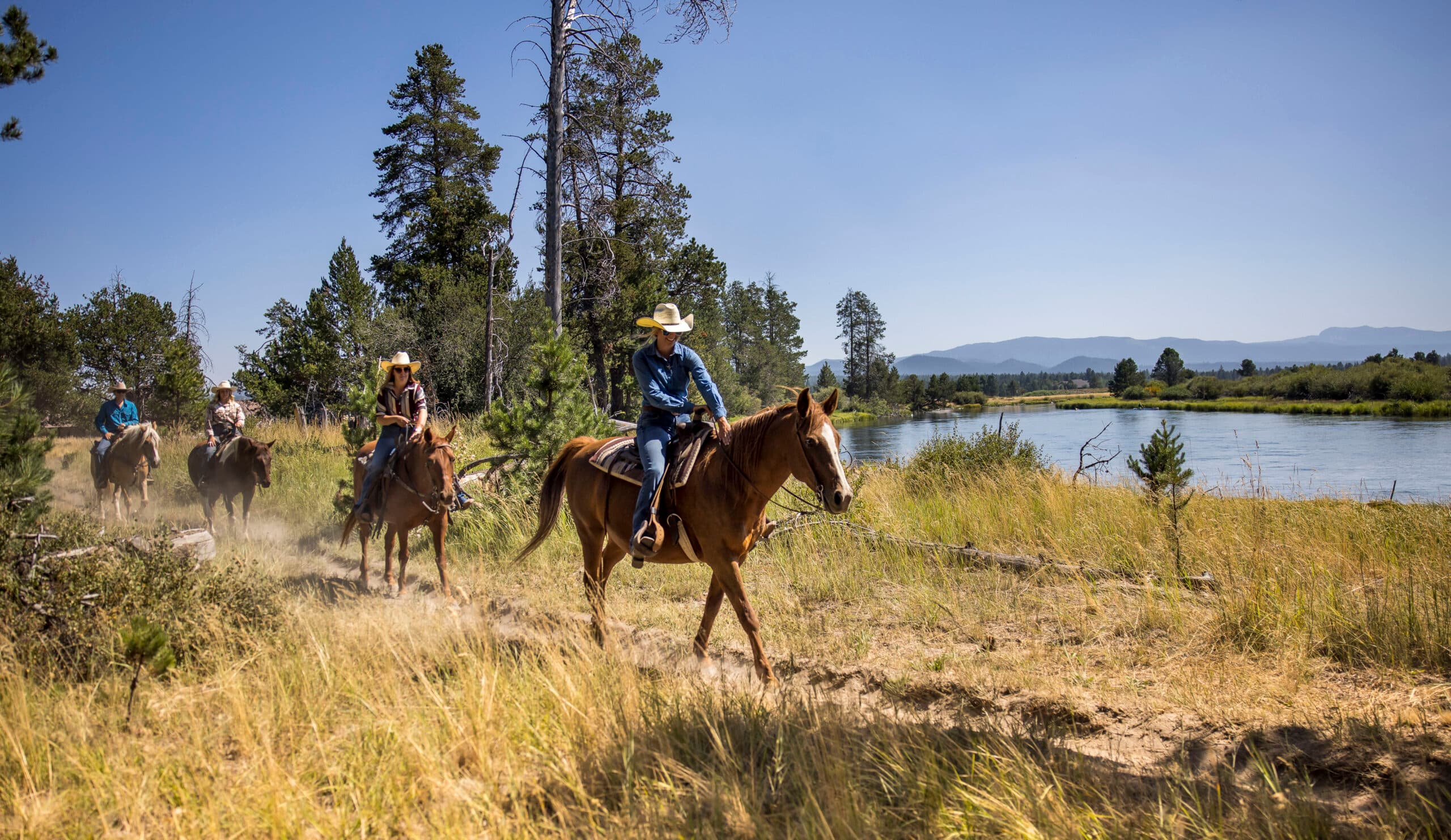 people riding horseback at sunriver resort